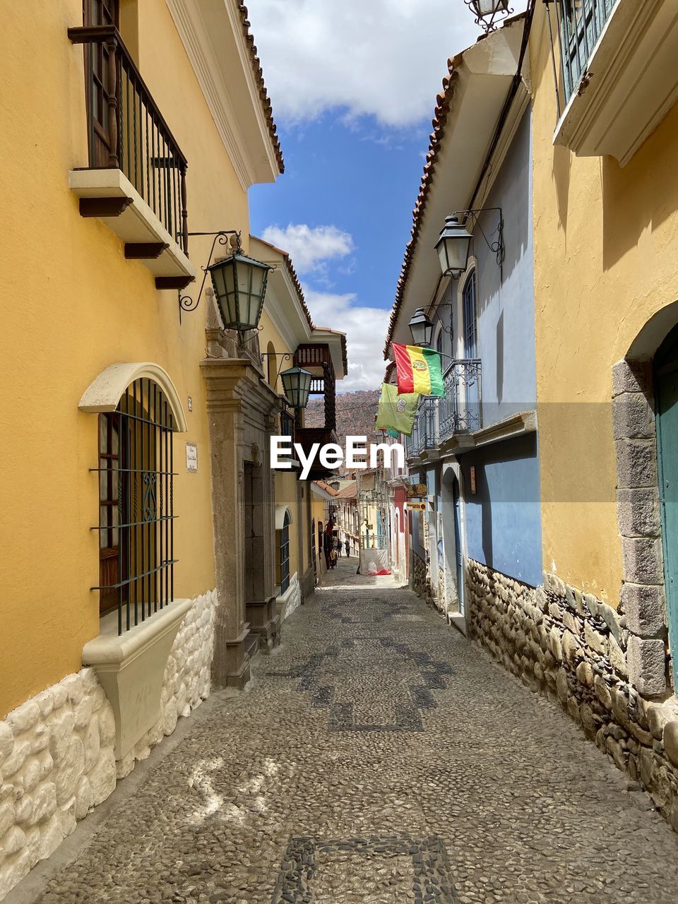 Narrow alley amidst buildings in city