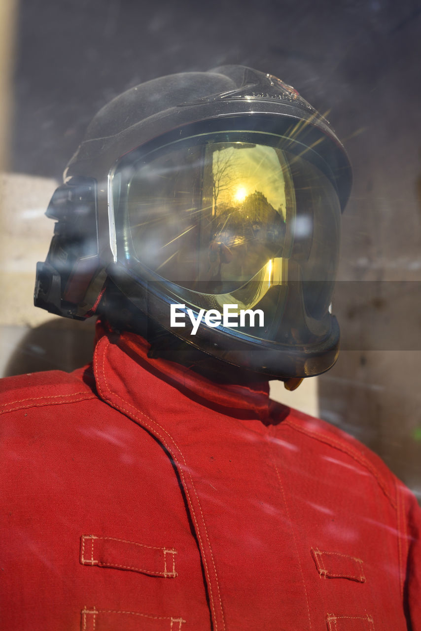 Firefighter mannequin with uniform and golden visor helmet