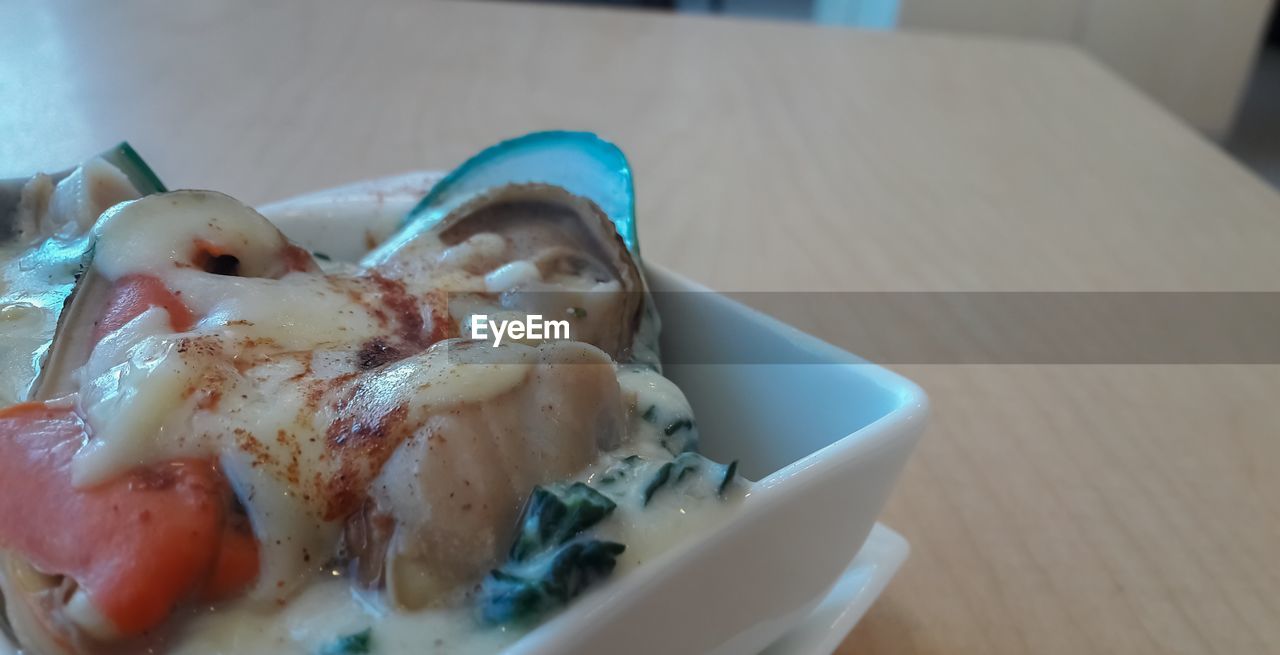 CLOSE-UP OF FOOD ON TABLE