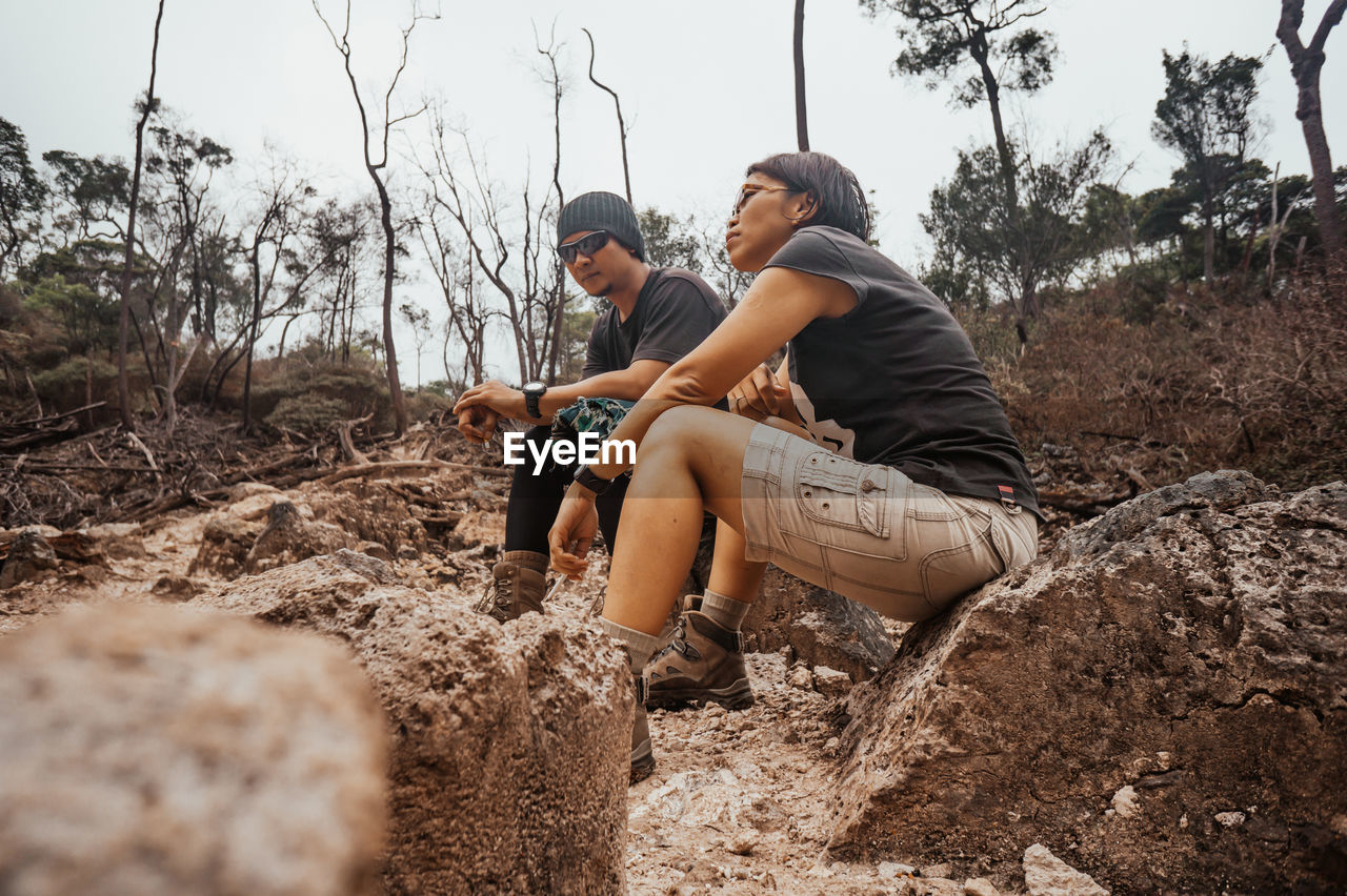 Young couple sitting on land