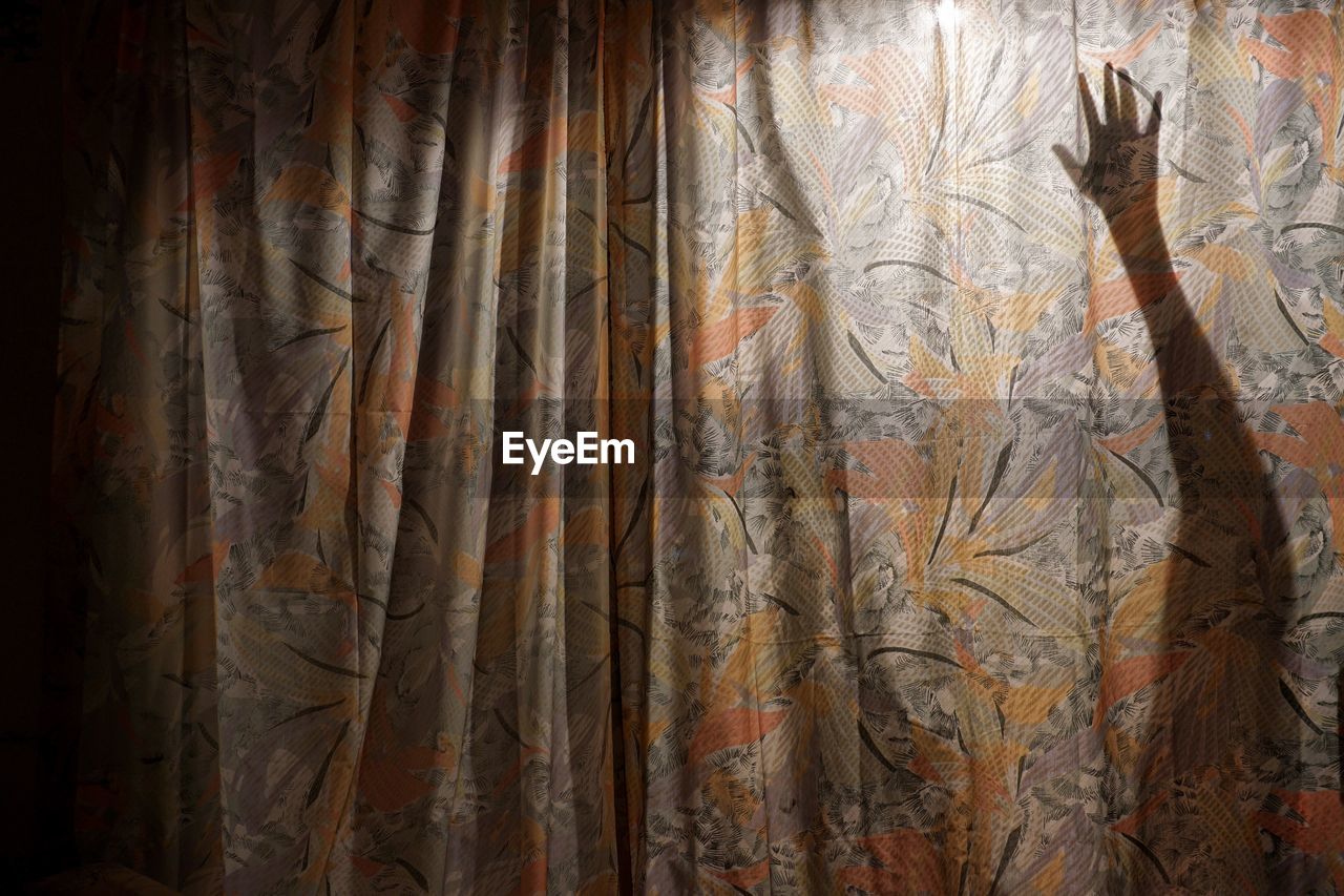 Person shadow on curtain