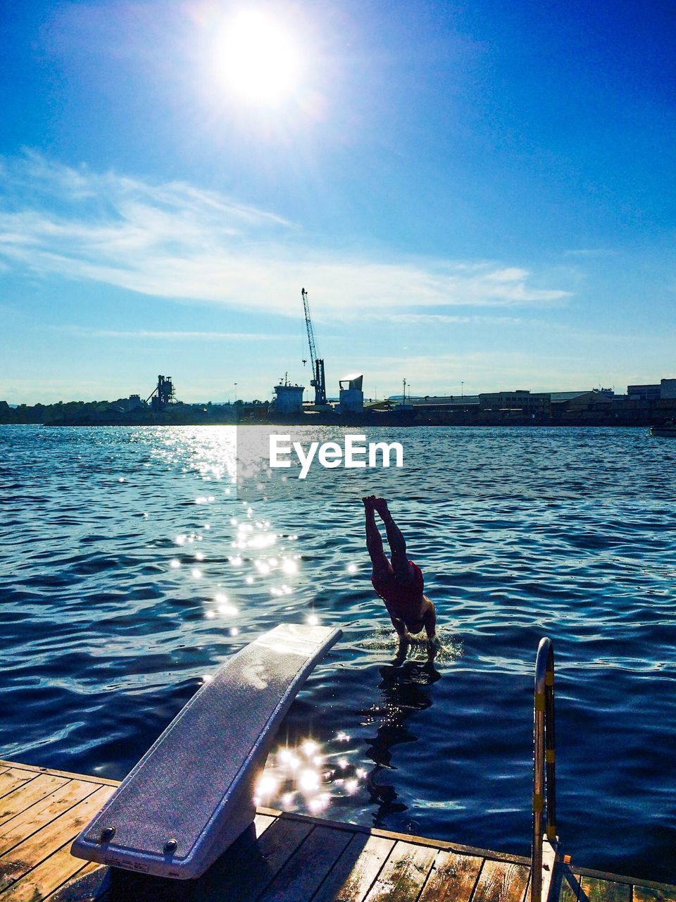 Full length of man diving into lake