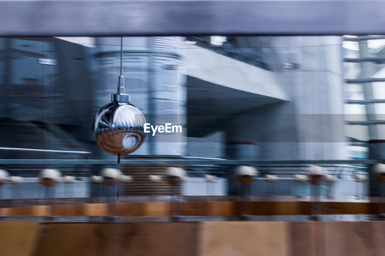 CLOSE-UP OF BLURRED MOTION OF TRAIN AT SUBWAY STATION