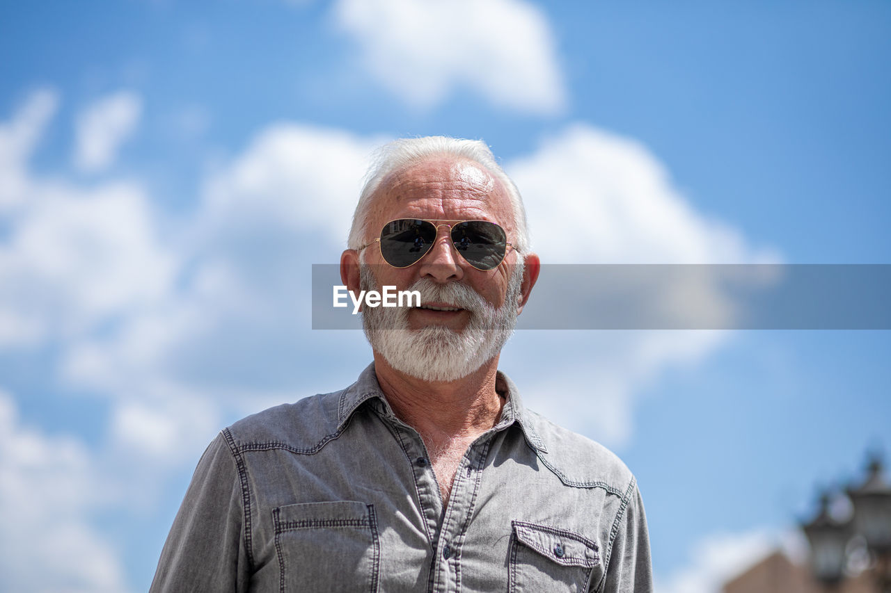 Portrait of man against sky