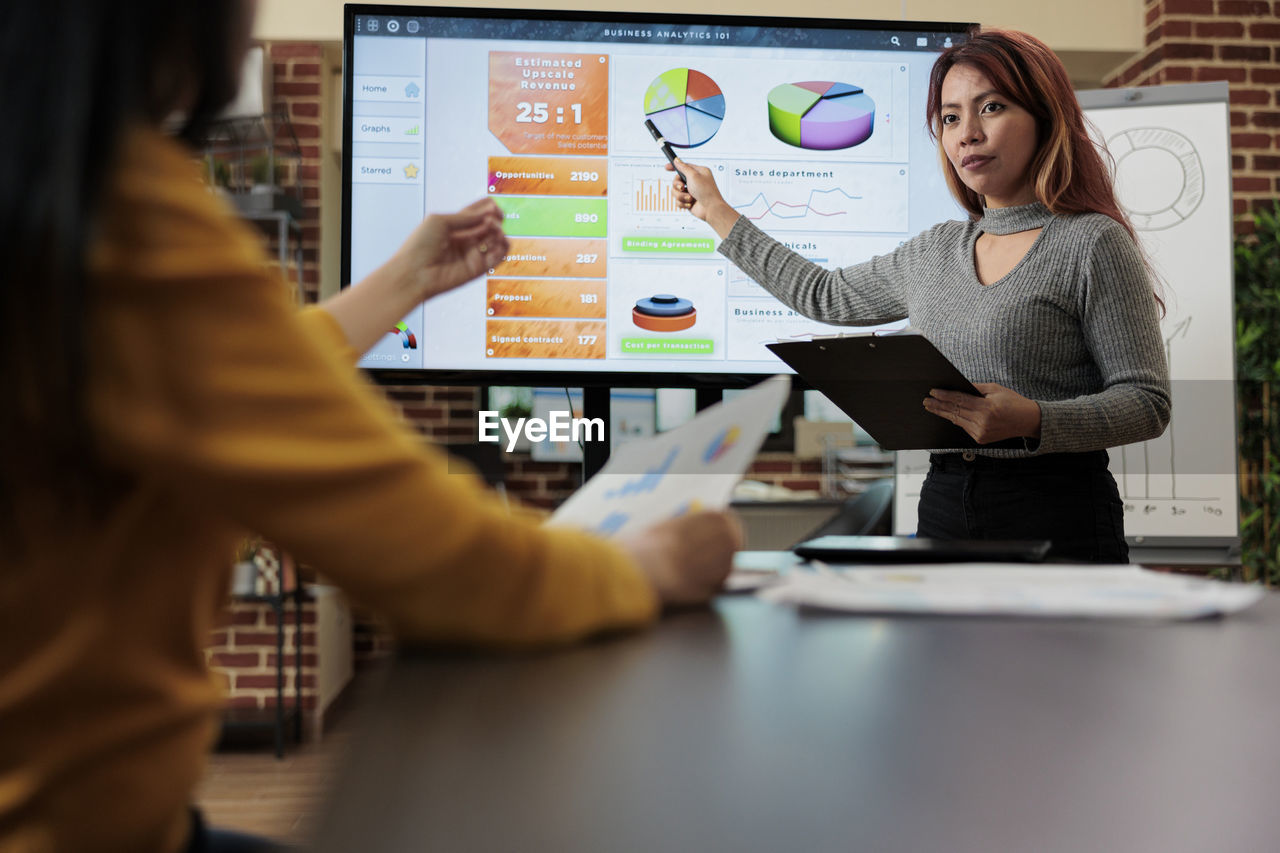 portrait of businesswoman using laptop on table