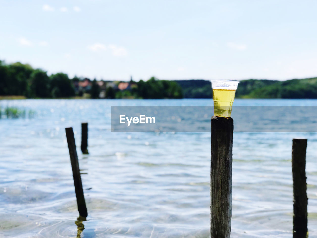 water, sea, shore, post, nature, wooden post, wood, no people, day, sky, beach, focus on foreground, ocean, outdoors, coast, reflection, tranquility, beauty in nature, wave, scenics - nature, body of water, boating