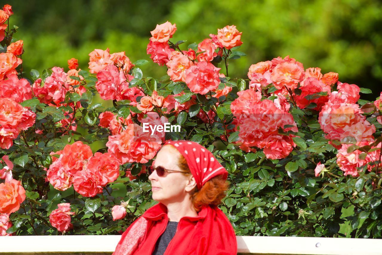 Portrait of woman with pink flowers