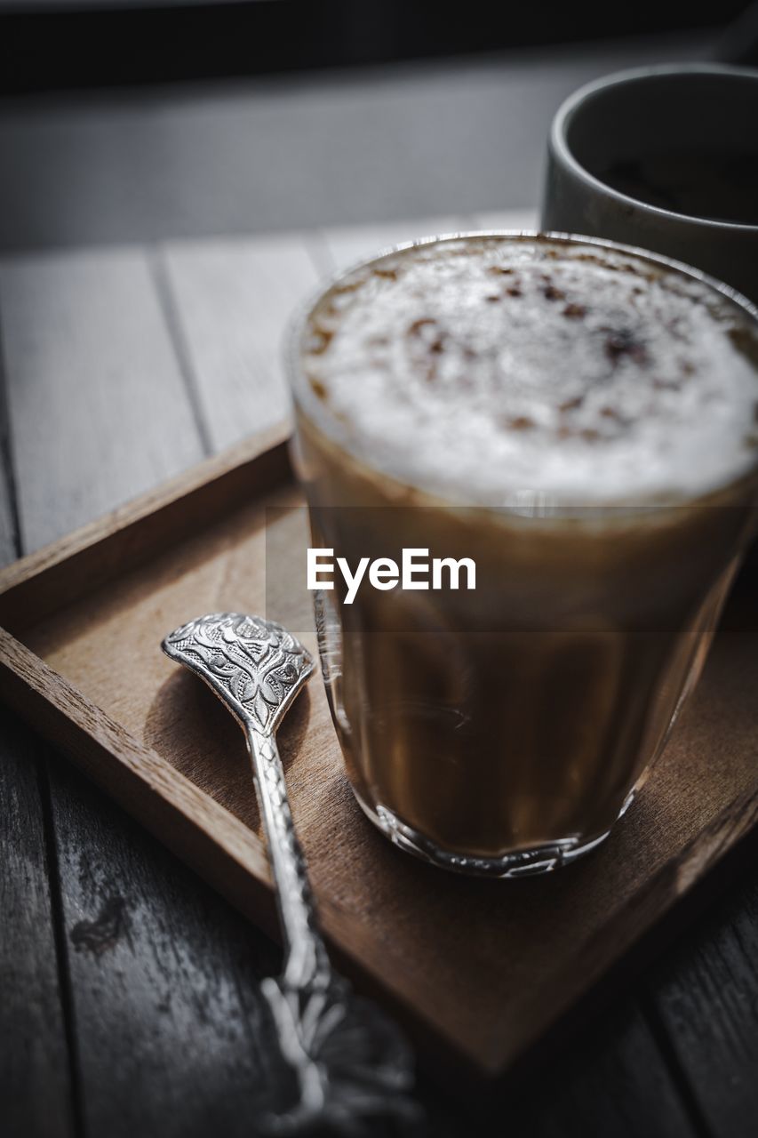 CLOSE-UP OF COFFEE IN GLASS