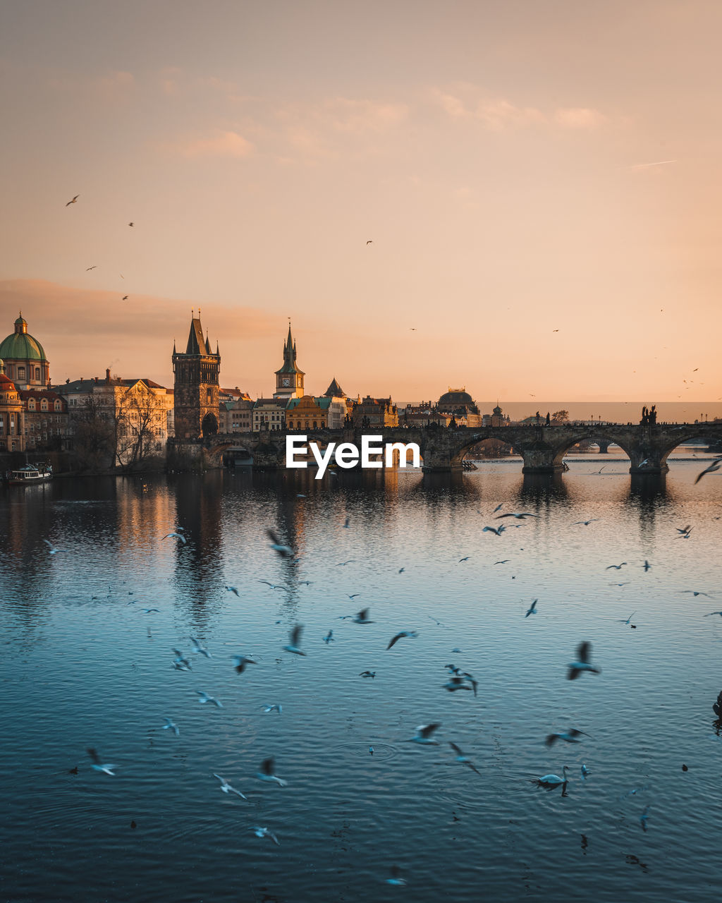 Scenic view of river against sky during sunset