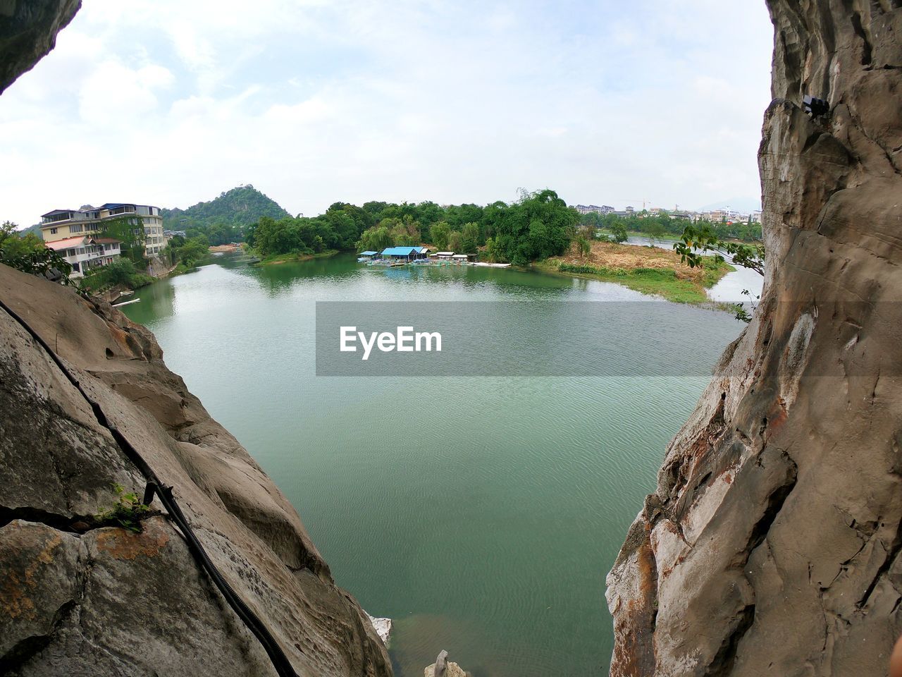 SCENIC VIEW OF LAKE BY TREES AGAINST SKY