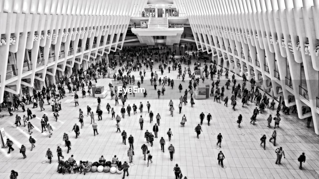 High angle view of people walking in train station