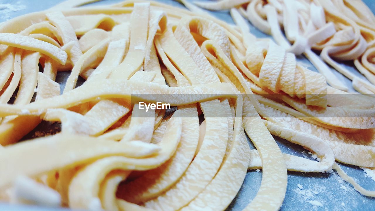 Close-up of raw fettuccine on table