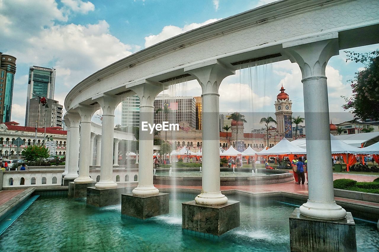 View of pond against buildings