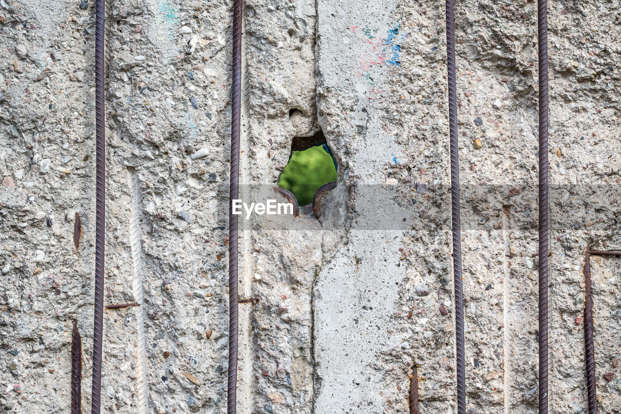 Full frame shot of historic berlin wall with hole