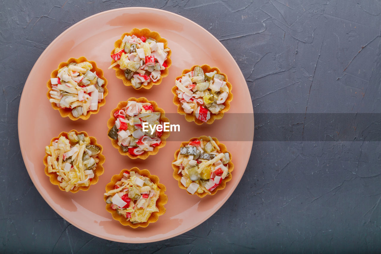 food and drink, food, snack, freshness, healthy eating, directly above, icing, sweet food, no people, dessert, produce, fruit, wellbeing, high angle view, sweet, indoors, nonpareils, plate, yellow, studio shot, table, dish, wood