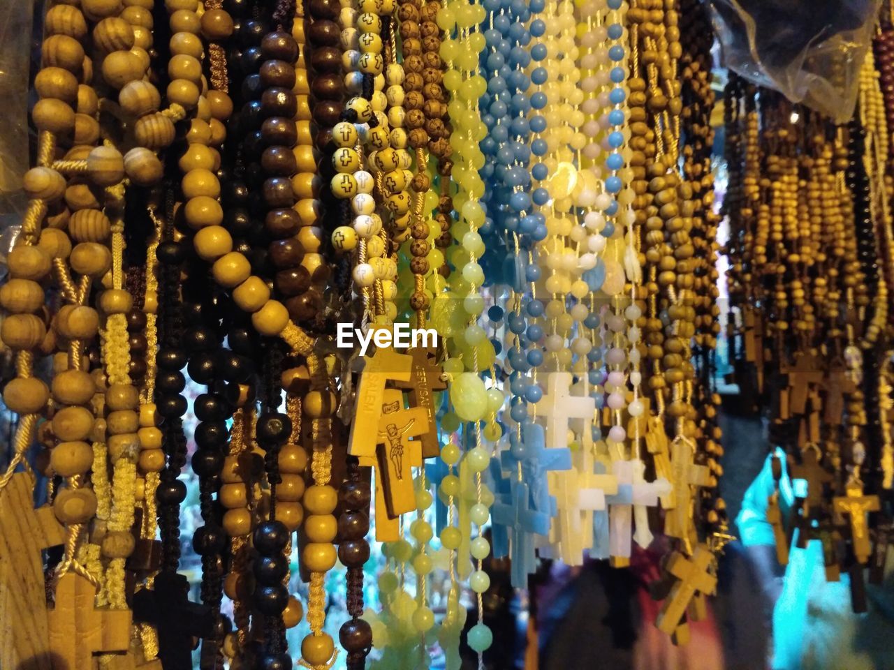 Close-up of rosary for sale in market