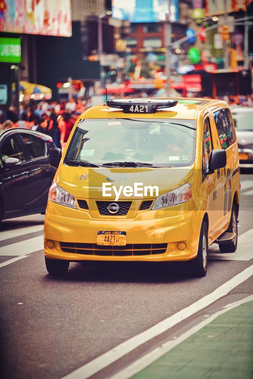 VIEW OF YELLOW TRAFFIC ON ROAD