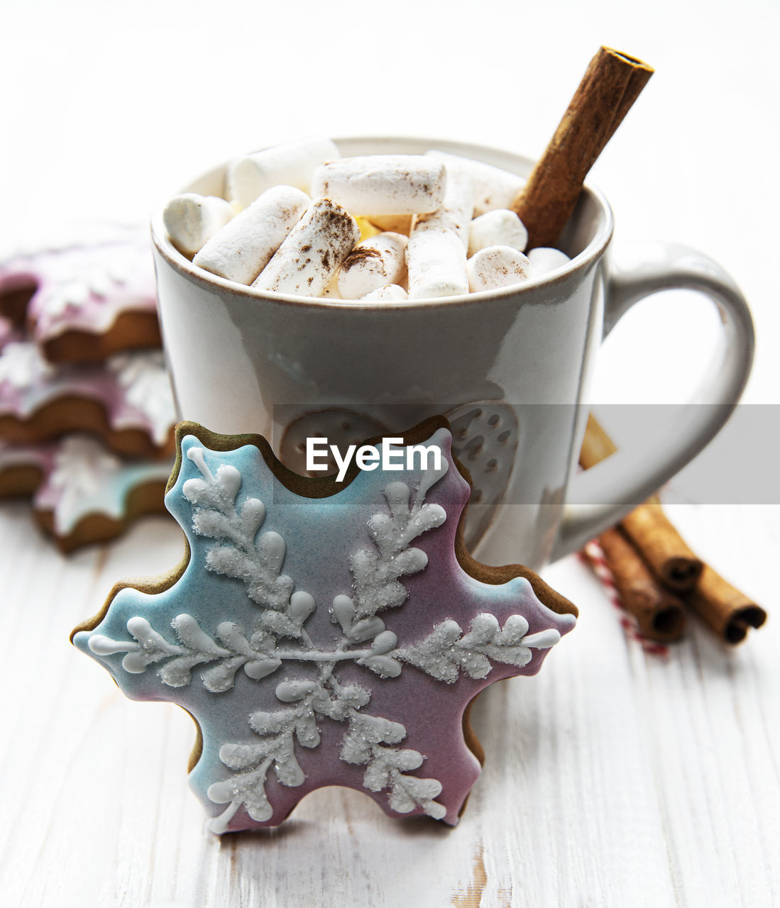 Christmas cocoa, gingerbread cookies and decorations. white wooden background.