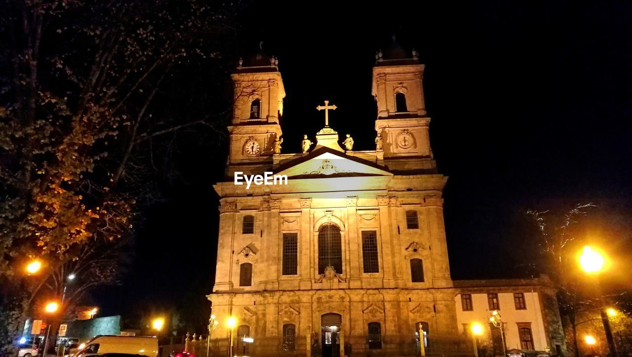 LOW ANGLE VIEW OF ILLUMINATED CATHEDRAL