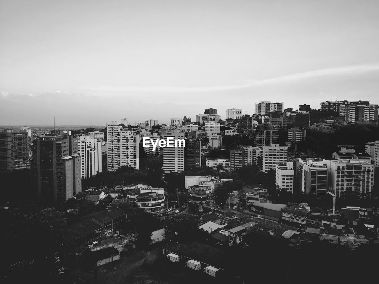 High angle view of buildings in city against sky