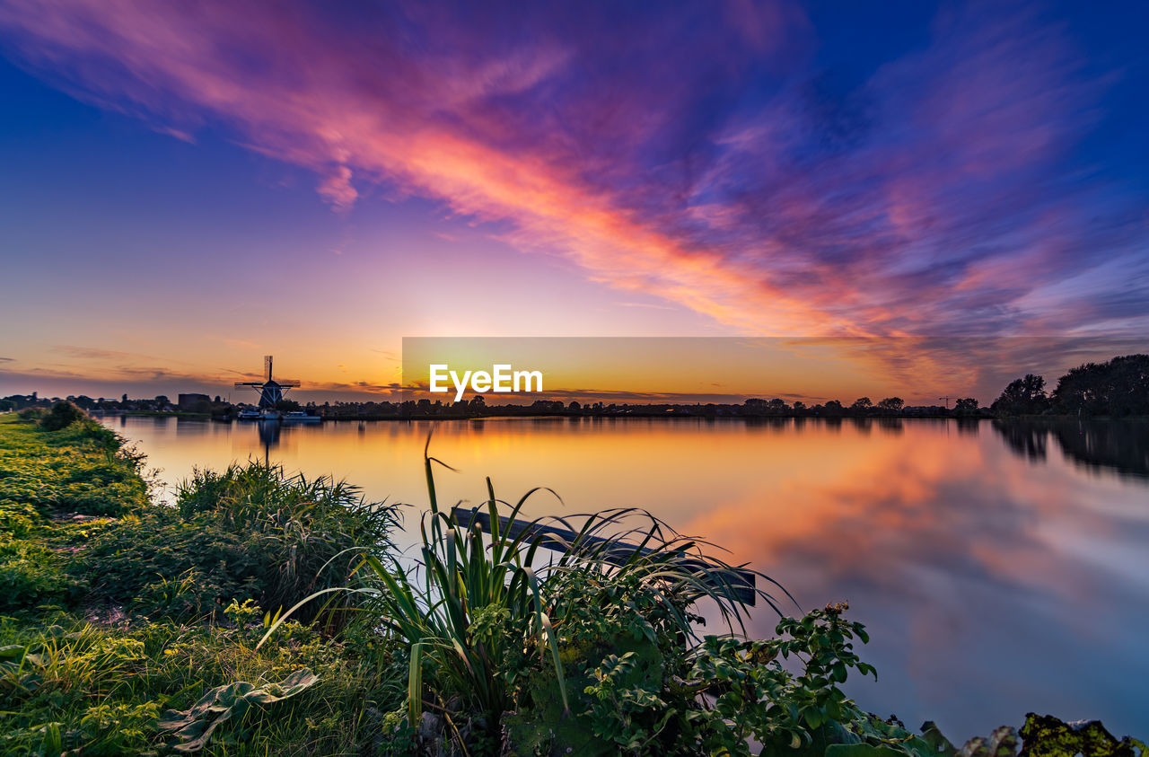 SCENIC VIEW OF LAKE DURING SUNSET