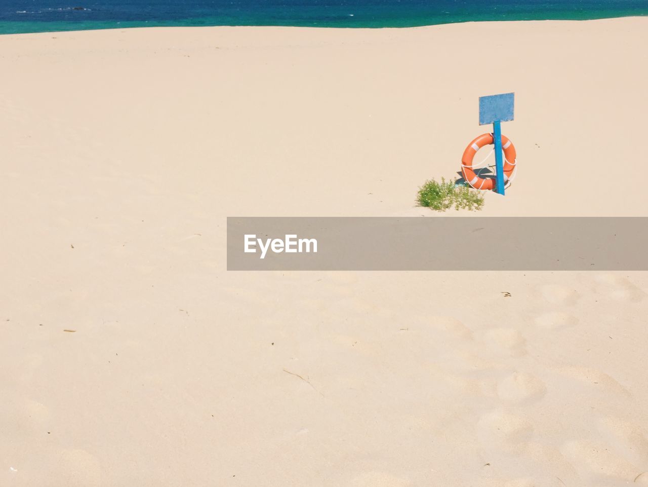 High angle view of life belt on abandoned beach