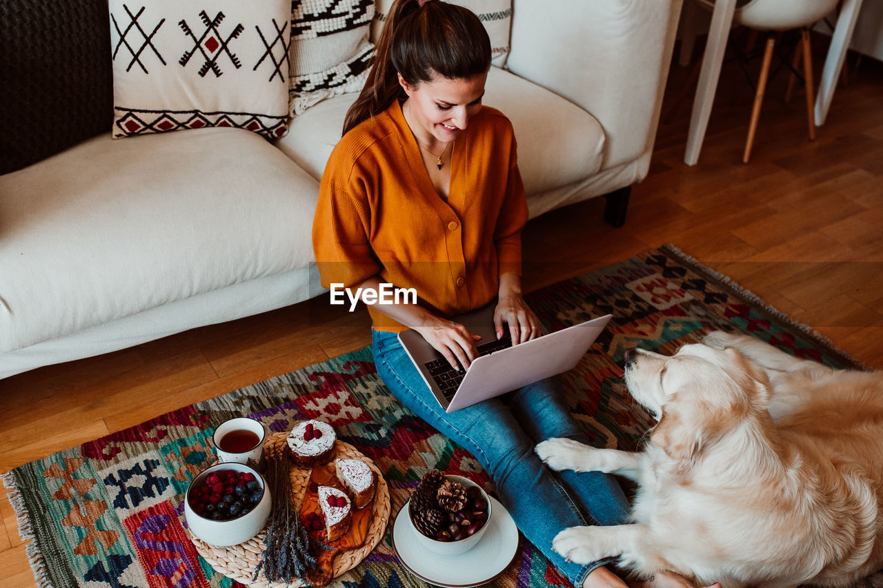 Woman with dog at home