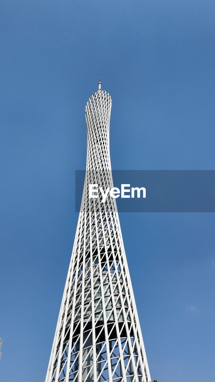 architecture, built structure, sky, landmark, skyscraper, tower, building exterior, blue, low angle view, city, nature, tower block, no people, spire, travel destinations, day, office building exterior, building, outdoors, travel, copy space, cloud, tourism, clear sky