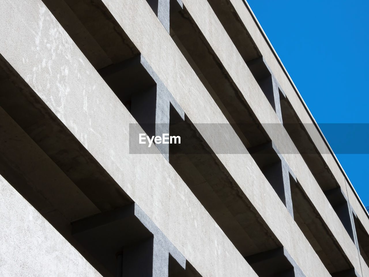 architecture, built structure, line, building exterior, city, no people, facade, white, sky, low angle view, clear sky, nature, blue, day, outdoors, building, daylighting, pattern, landmark, skyscraper
