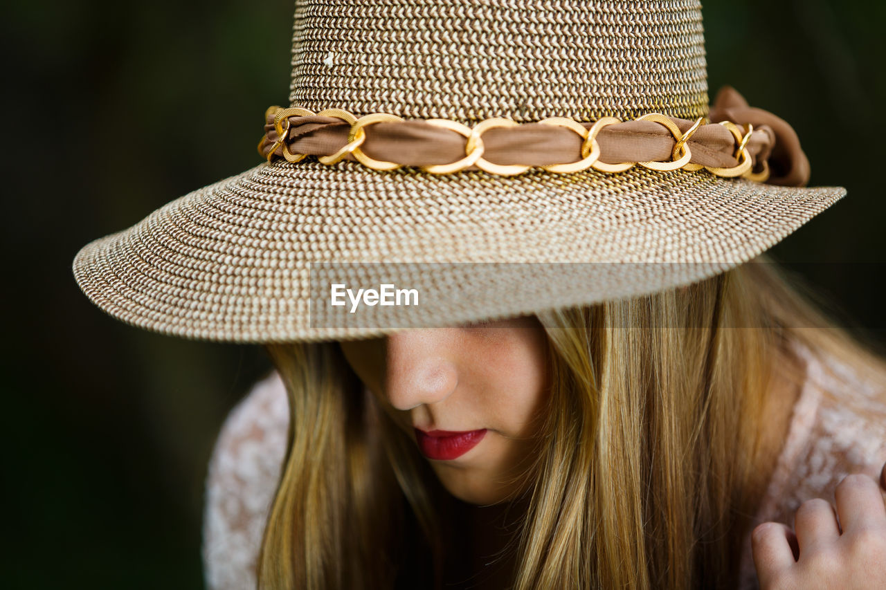 Close-up of woman wearing hat