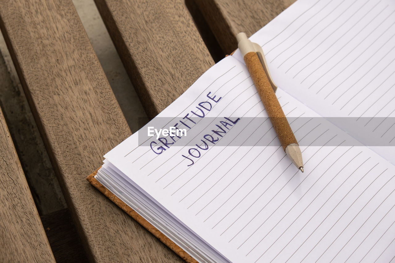 high angle view of pen on book