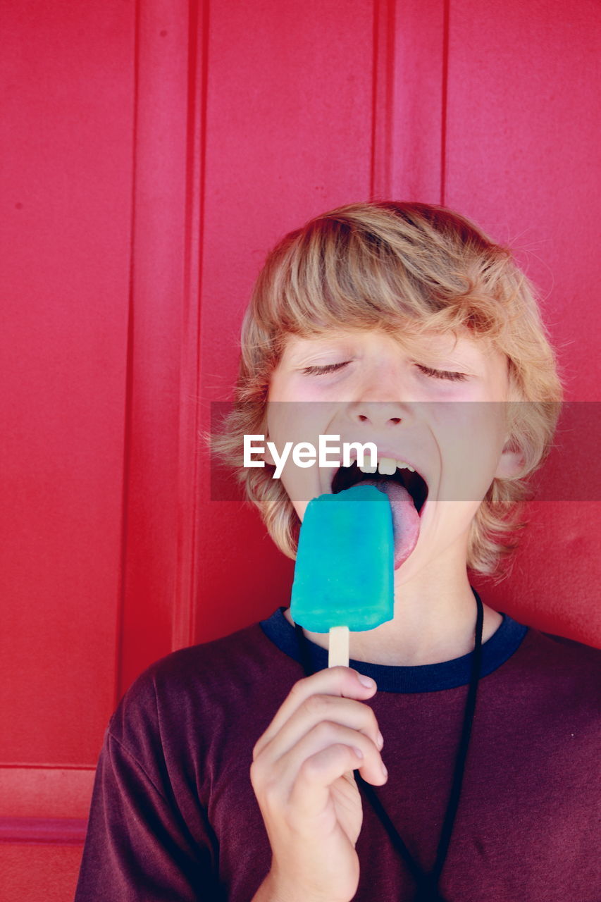 Close-up of a boy eating ice cream