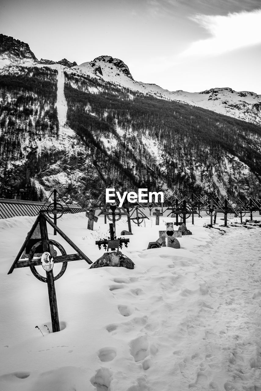 Scenic view of snow covered field against sky