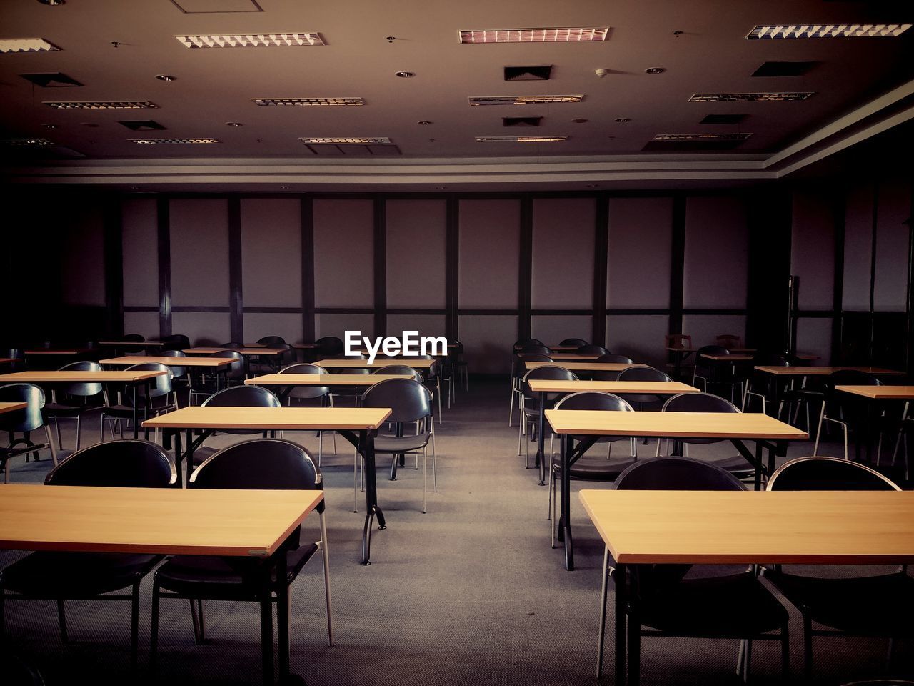 Empty chairs and tables in room, vintage or retro tone