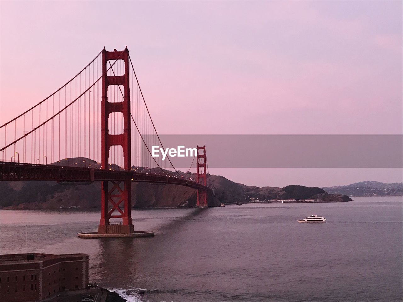 VIEW OF SUSPENSION BRIDGE AGAINST SKY