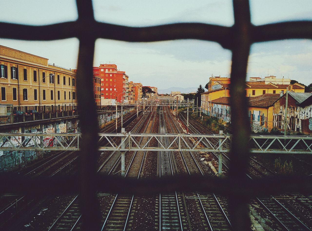 Rail yard view through a grid