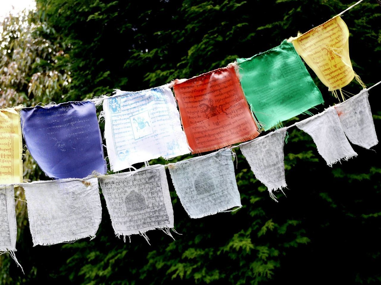 Colorful flags hanging on string