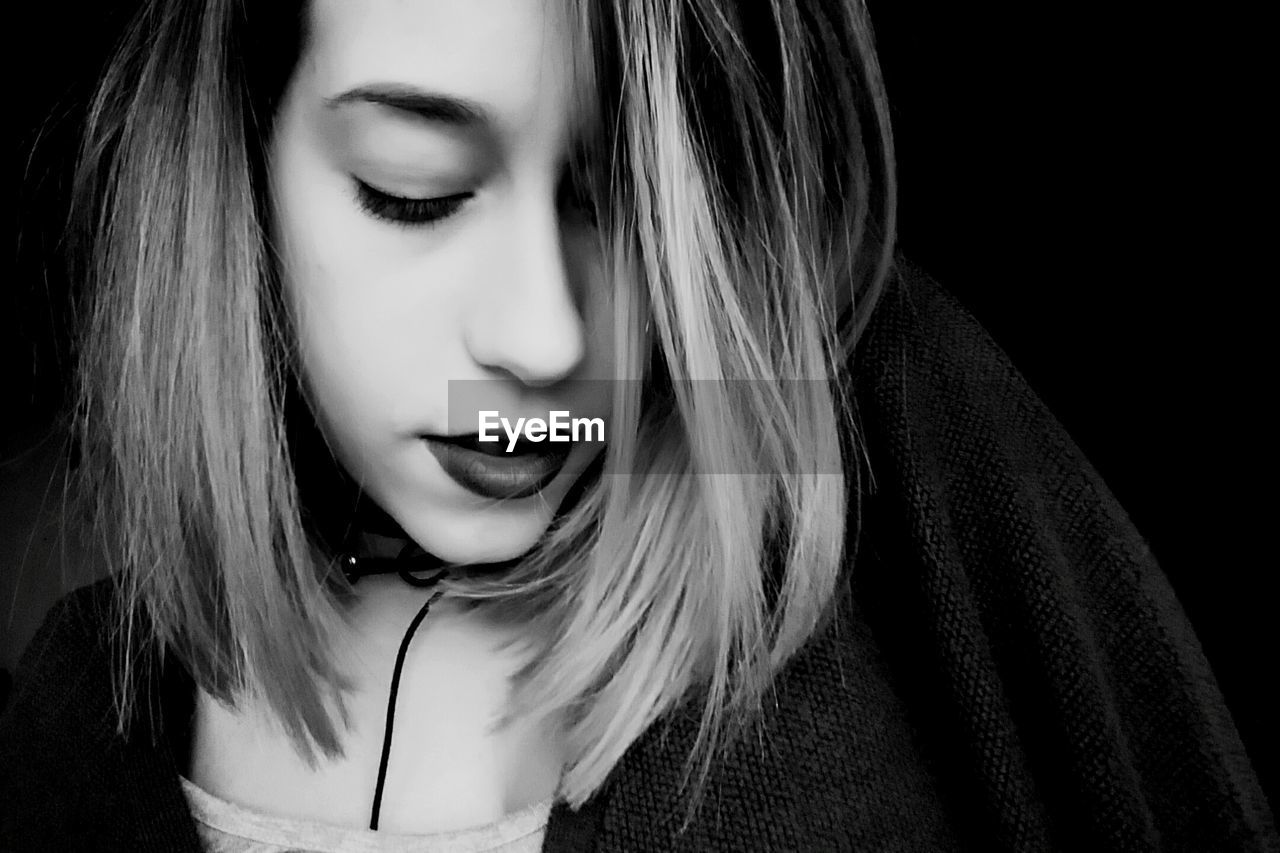 CLOSE-UP OF YOUNG WOMAN WITH EYES