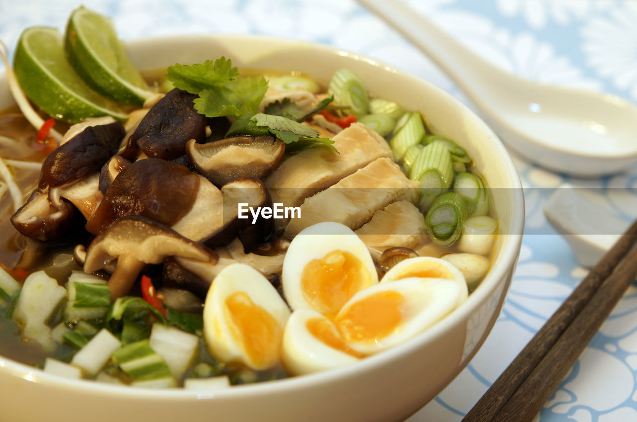 Close-up of ramen noodles in bowl on table