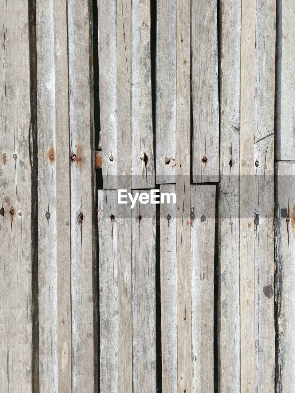 Full frame shot of texture of wooden planks of a pier in a floating village