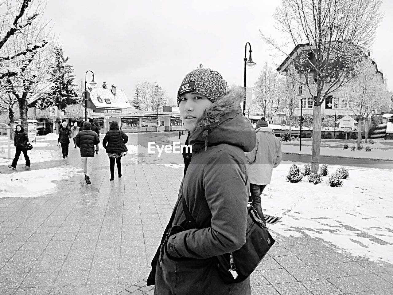 WOMAN WALKING ON CITY STREET