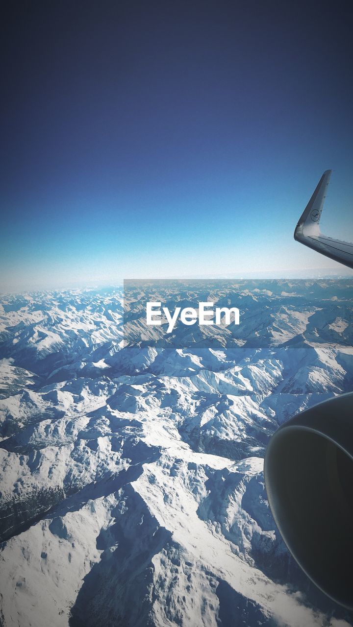 AERIAL VIEW OF AIRPLANE WING OVER LANDSCAPE