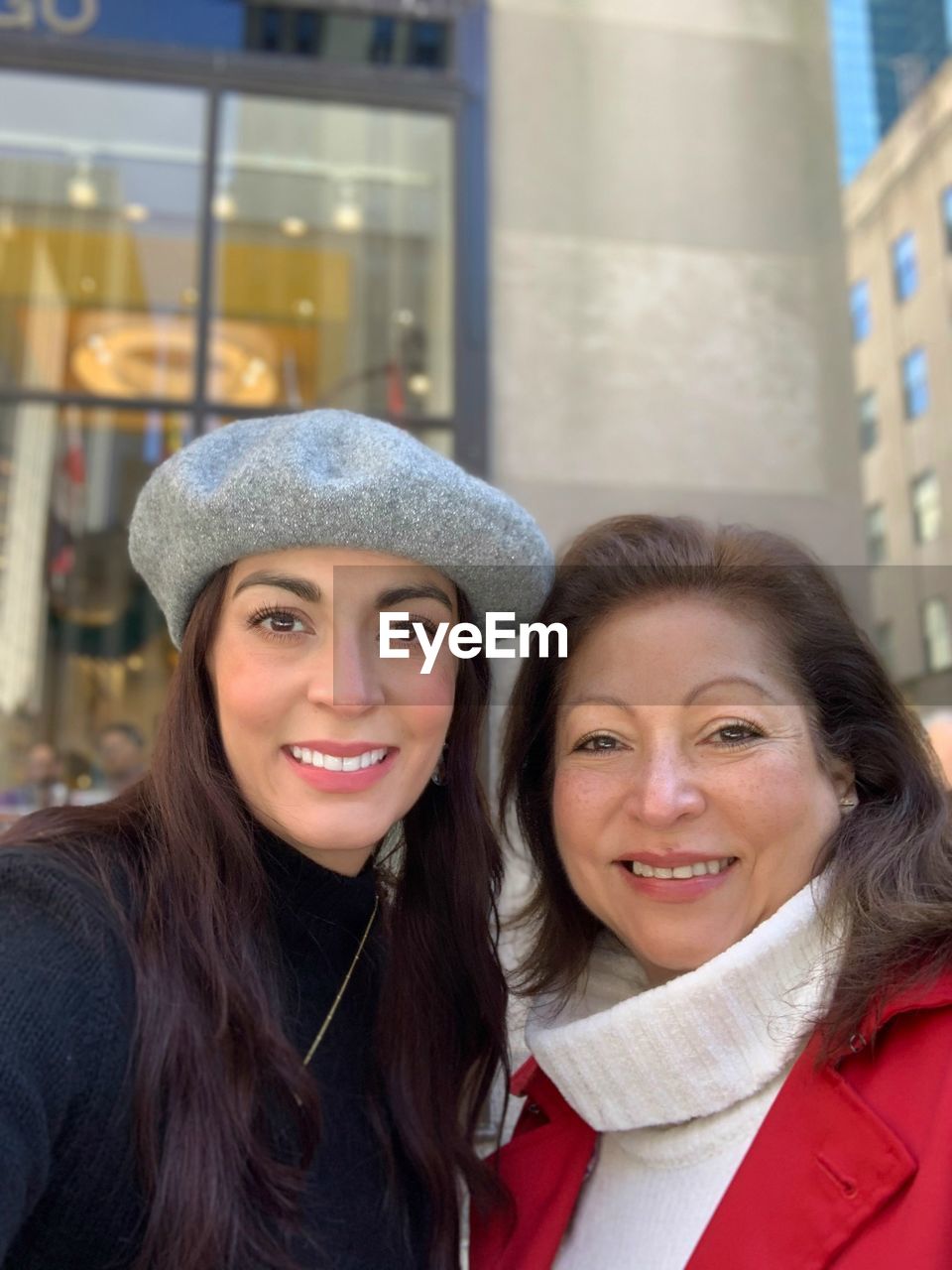 A big smile walking through the rockefeller center in new york