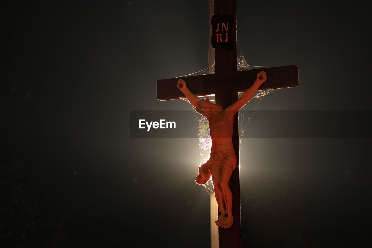 Close up of jesus against black background