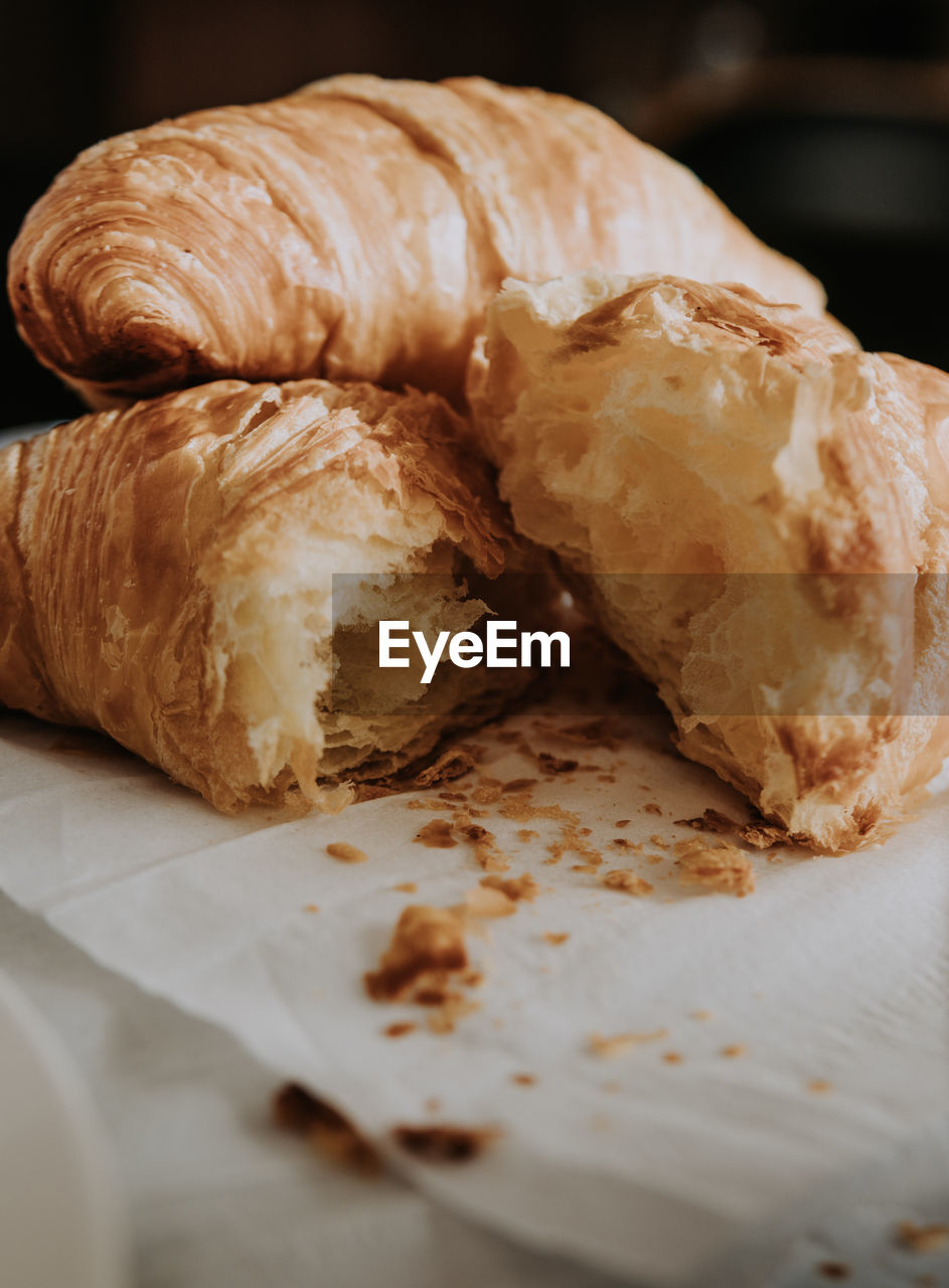 Close-up of croissants in plate on table