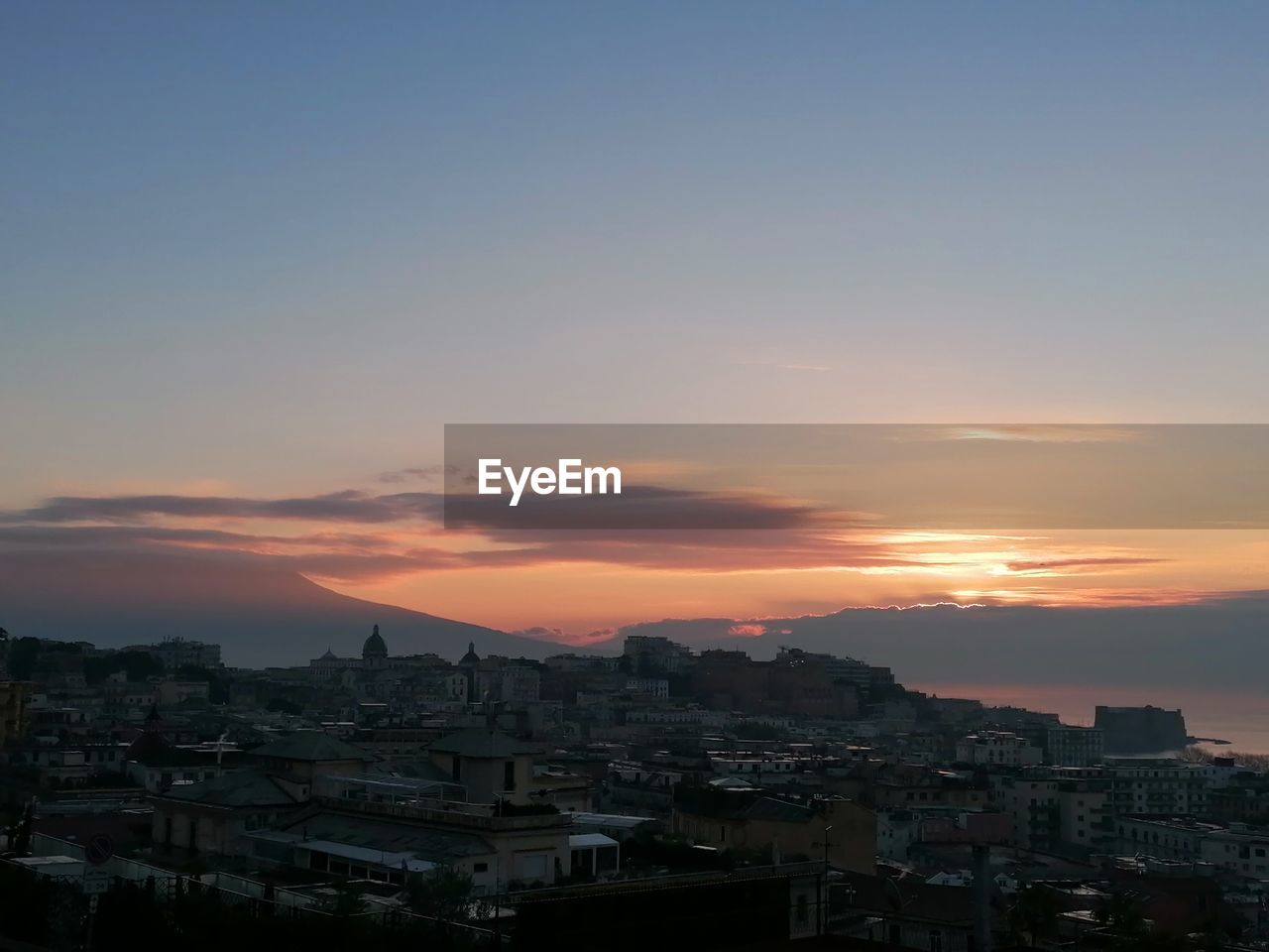 High angle view of townscape against sky during sunset