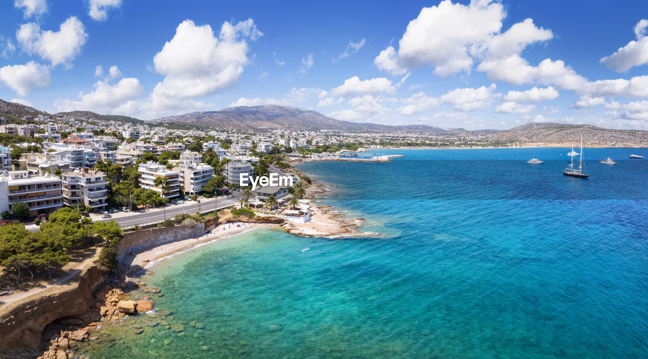 high angle view of sea and mountains against sky