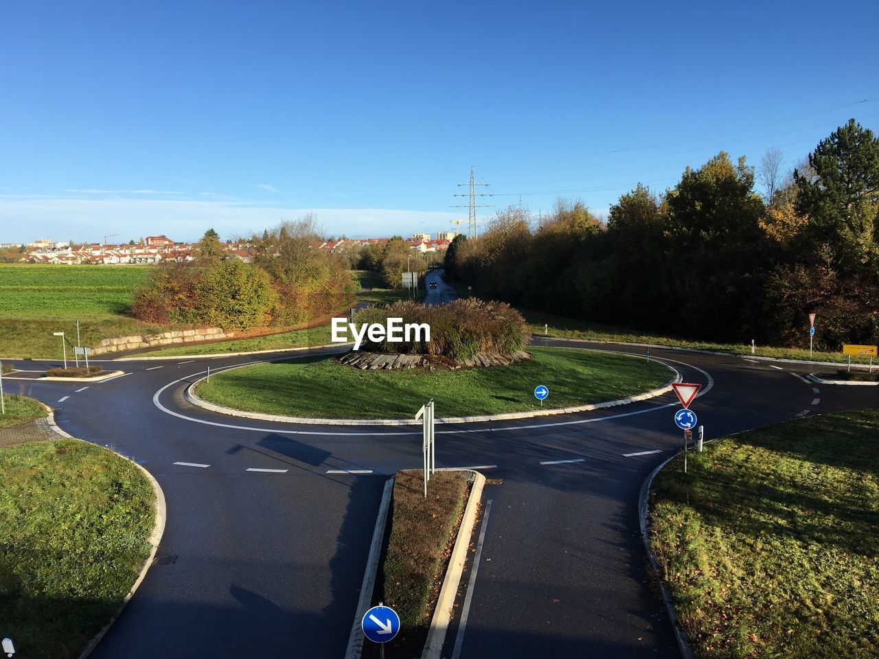 ROAD IN PARK AGAINST CLEAR SKY