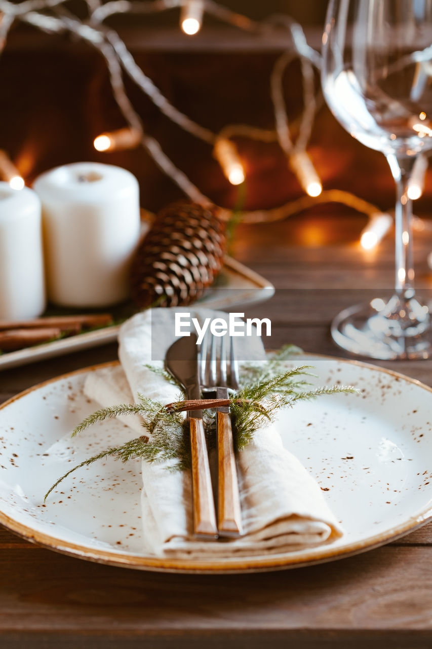 Close-up of cutlery in plate on table