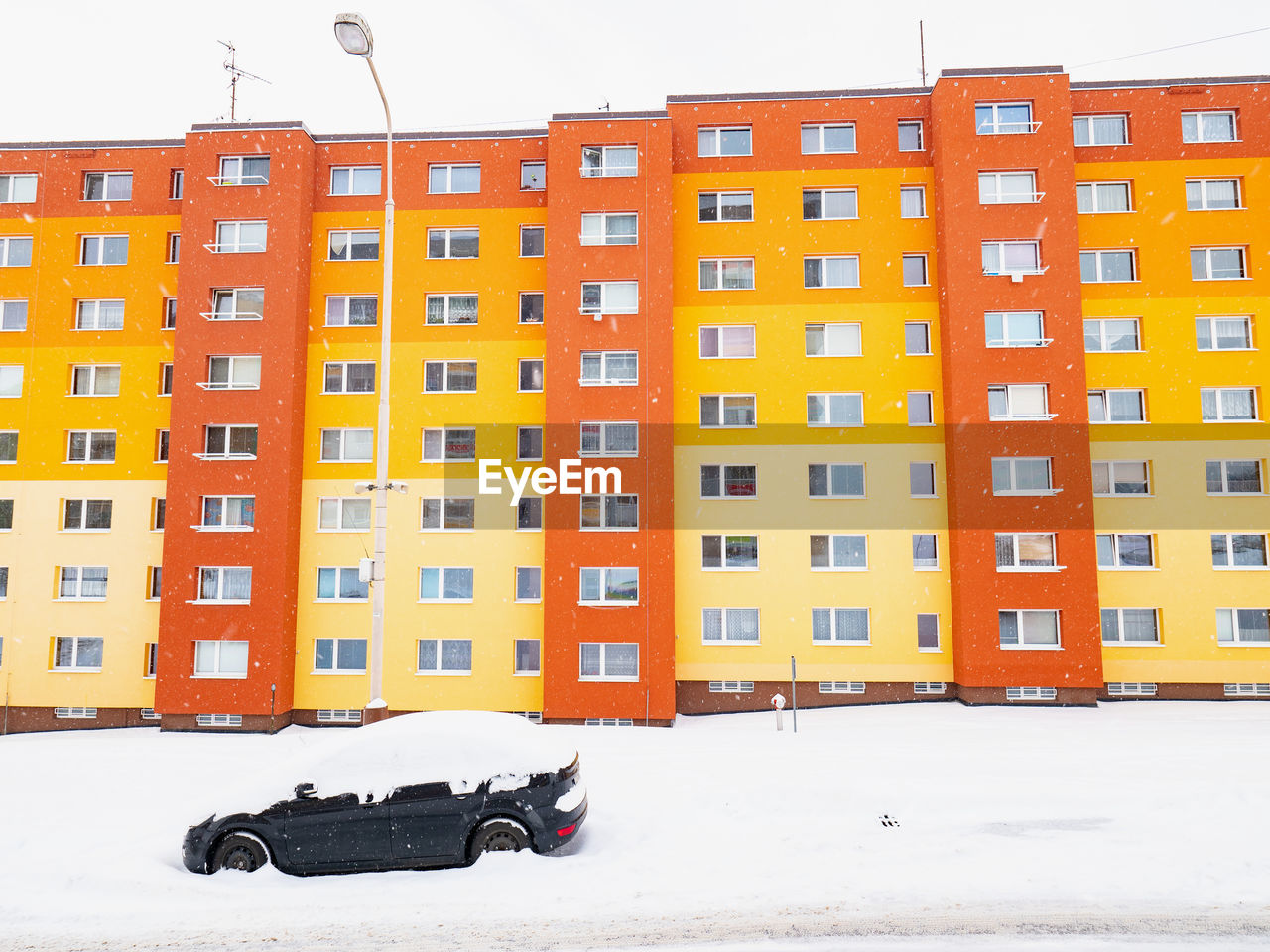 VIEW OF SNOW COVERED APARTMENT BUILDING